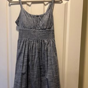 Dress barn size 14 but fits more like a 10. Denim short dress with padded cups.